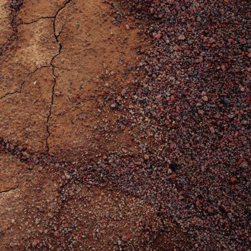 shopthietke com Close up of cracked dry soil on the left and dark reddish brown small gravel on the right